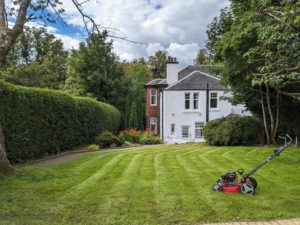 White house with freshly cut lawn